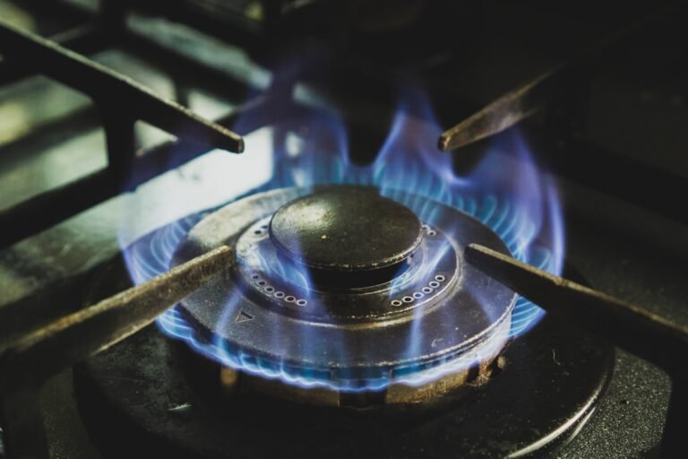 A gas stove with burners lit during busy festive-season cooking