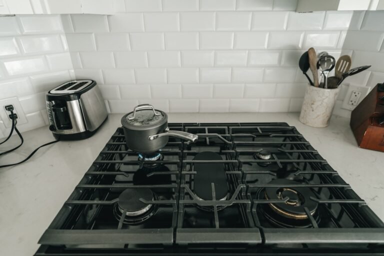 A gas stovetop in a kitchen, where a gas smell should always be taken seriously
