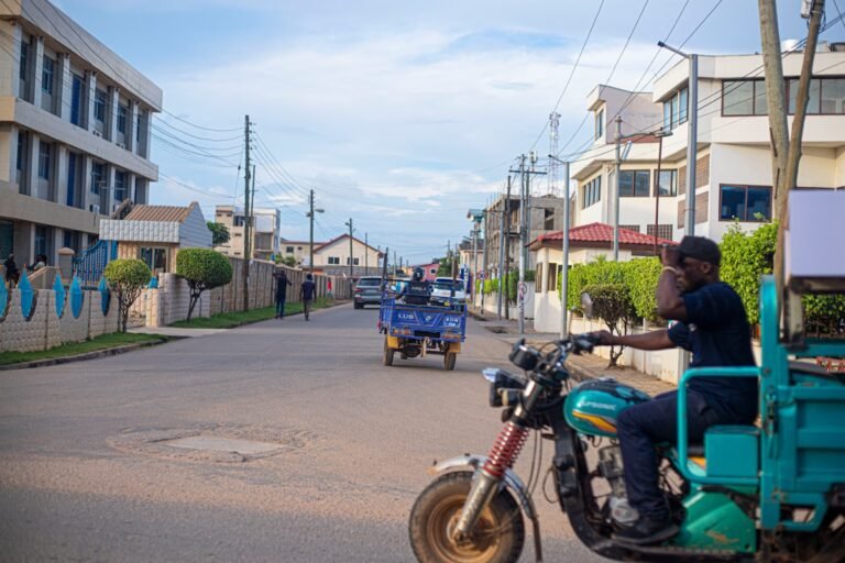 A motorbike rider on a busy street, the backbone of reliable cooking gas delivery