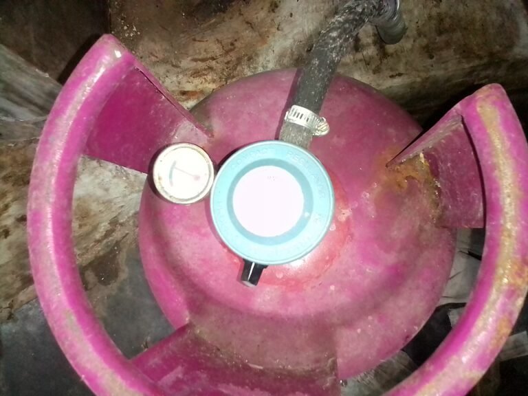 LPG cylinder with a regulator connected at the top