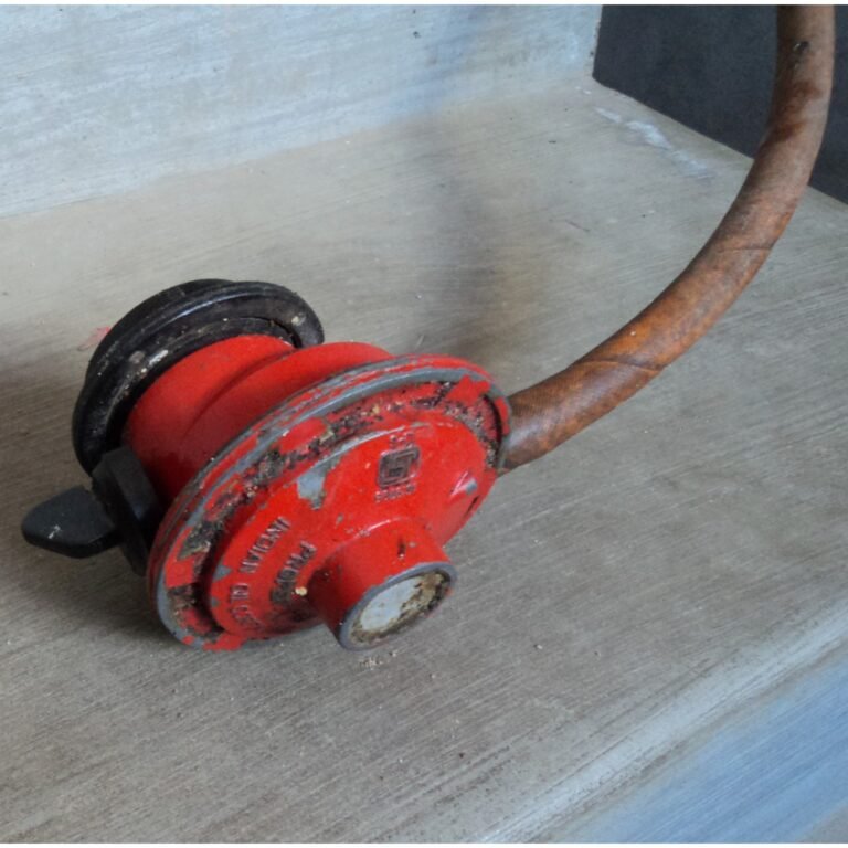 LPG gas regulator fitted on top of a cooking gas cylinder