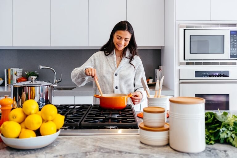 Woman cooking on a gas stove in a home kitchen